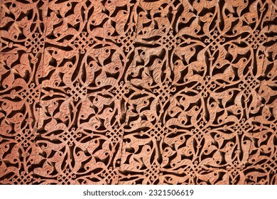 Wall decorative patterns of Qutb complex in South Delhi, India, close up ancient bas relief wall decorations of mosque ruins landmark, popular touristic spot in New Delhi, ancient indian architecture