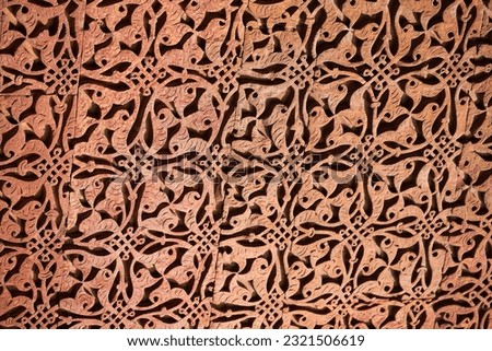 Wall decorative patterns of Qutb complex in South Delhi, India, close up ancient bas relief wall decorations of mosque ruins landmark, popular touristic spot in New Delhi, ancient indian architecture