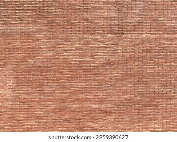 Wall with exposed solid ceramic brick aged by time. solid brick large scale texture.