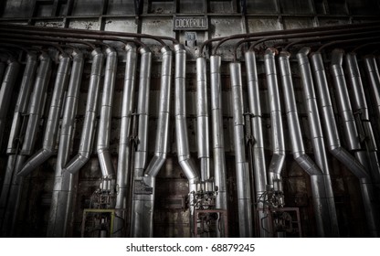 A wall filled with pipes, creating a texture like background. Shot made at an abandoned factory.