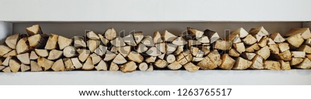 wall firewood, Background of dry chopped firewood logs in a pile. panorama