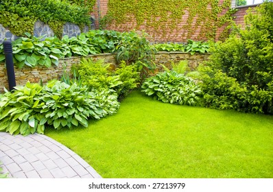 A wall Garden with cipress and bushes - Shutterstock ID 27213979