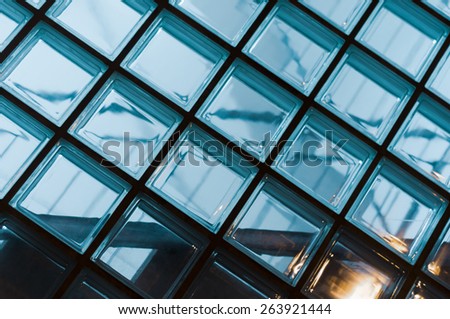 Wall of glass blocks in blue light