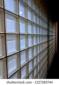 A Wall Of Glass Bricks At Night, Disappearing Off Into The Perspective At A Motorway Service Station On The M1 In The UK