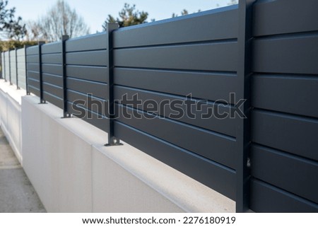 wall grey modern barrier and fence of private individual house of suburb house design protection view home garden