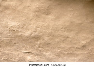 Wall Grunge Texture Abstract Background. The Wall Surface Is Plaster Or Natural Primer Material. Grungy Vintage Natural Clay Textured Surface Material.