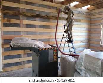 Wall Insulation With Cellulose Insulation. Blowing Into The Walls Through A Hose