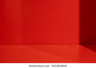Wall interior background, studio  and backdrops show products.with shadow from window color Red background for text insertion and presentation product 