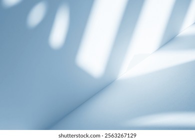 Wall interior background, studio  and backdrops show products.with shadow from window color white and blue light. background for text insertion and presentation product 