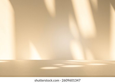 Wall interior background, studio  and backdrops show products. with leaf shadow from window color beige and white. background for text insertion and presentation of product 