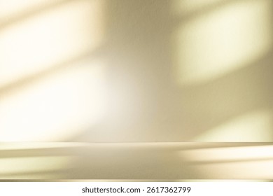 Wall interior background, studio  and backdrops show products. with leaf shadow from window color beige and white. background for text insertion and presentation of product 