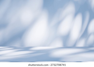 Wall interior background, studio  and backdrops show products. with leaf shadow from window color blue tone. background for text insertion and presentation of product