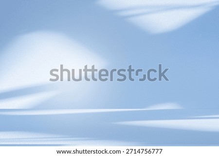 Wall interior background, studio  and backdrops show products. with leaf shadow from window color blue tone. background for text insertion and presentation of product
