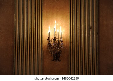 Wall Light Of Gilded Metal On Exquisite Marble Wall. Sconce Light