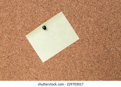 Wall made of cork with yellow sticky note. - Shutterstock ID 229703017