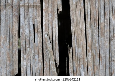 The Wall Is Made Of Old, Broken Wood.