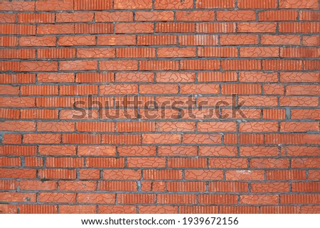 the wall is made of red brick. the texture of a brick wall. construction and renovation of the house