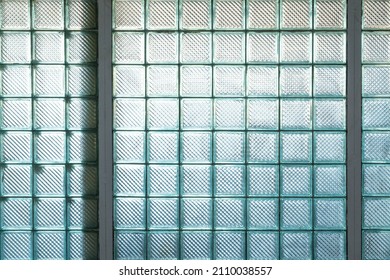 The wall is made of square construction glass blocks . Finishing material in the arrangement of the interior . Decorative element of interior partitions . 