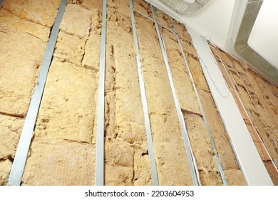 Wall With Metal Studs And Insulation Material Indoors, Low Angle View