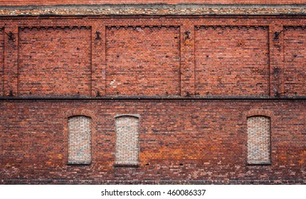 Wall Of The Old Factory Building Of Red Brick With Narrow Windows