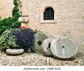 wall and old millstone