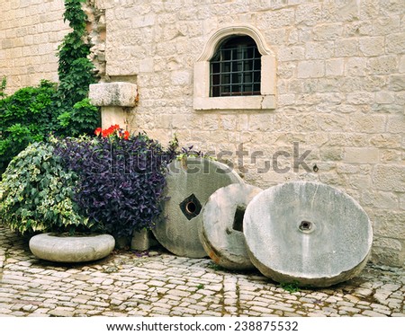 wall and old millstone