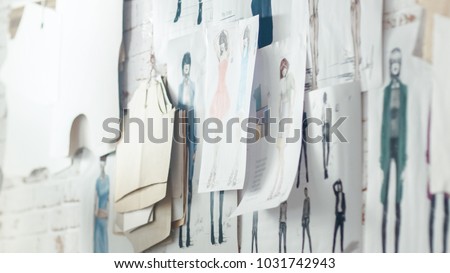 Wall with Pinned Fashion Drawings and Sketches, Templates Hanging on the Wall.