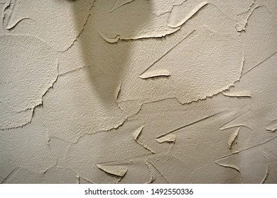 The Wall Is Plastered. Old Ugly Wall. Background Or Ragged Wall Texture For Design