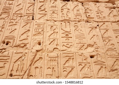 Wall Relief With Hieroglyphs At Precinct Of Amun Re. Karnak Temple Complex, Luxor, Egypt