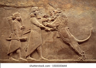 Wall relief from Mesopotamia, Assyrian image of Ashurbanipal lion hunt, detail. Babylonian and Sumerian history, remains of culture and art of ancient Middle East civilization. Iraq and Sumer theme.