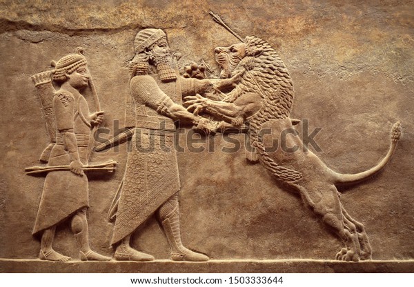 Wall relief from Mesopotamia, Assyrian image of\
Ashurbanipal lion hunt, detail. Babylonian and Sumerian history,\
remains of culture and art of ancient Middle East civilization.\
Iraq and Sumer theme.