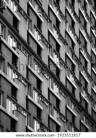 The wall of a residential building at the front and at an angle, the problem of the existence of an individual in the urban tissue, the repetition of simple geometric shapes, socialist and communist