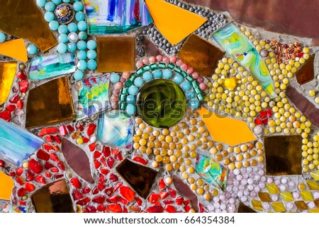 Wall sculptures with glass and tile parts. Wat Phra That Pha Son Kaew buddhist temple in Thailand.Crystal mirror glass, multi color