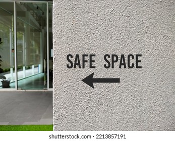 Wall With Sign Direction To SAFE SPACE, Places Where People Can Feel Confident - Free Of Bias, Conflict, Criticism Or Discrimination, No Emotional Or Physical Harm