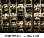 Wall of Skulls. A stone wall with skull carvings found at the Templo Mayor in Zocalo, Mexico City.