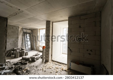 Wall smashed into debris room in apartment ready for renovation with destroyed smashed wall demolish