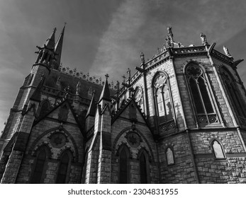 The wall of St. Colman's Cathedral in Cobh, Ireland. Religious European architecture. Black and white.