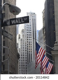 Wall Street And Broadway Street Signs At Manhattan