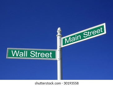 Wall street vs Mainstreet conceptual sign against a clear blue sky