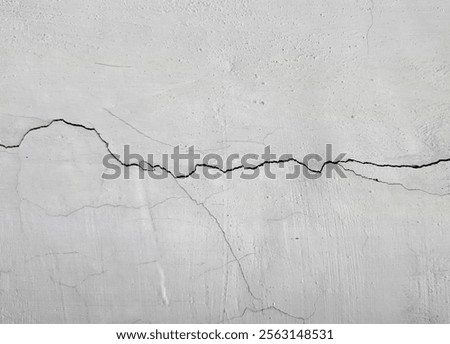 Wall texture background. Crack wall texture. Cracked concrete wall covered with cement surface as background. Wall fragment with scratches and cracks.