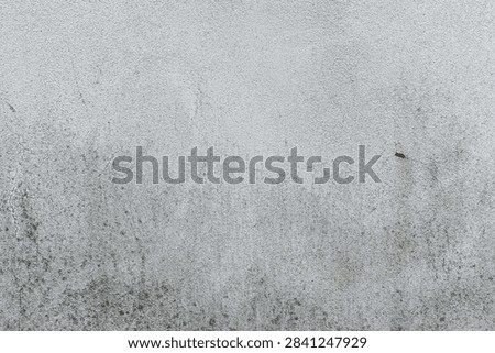 Wall texture background with rustic plaster, grimy details, and distressed surfaces creating an old weathered appearance.
