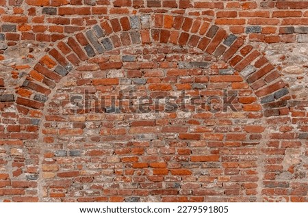 Wall texture with geometry with old red brick, brick wall with red e gray brick archway