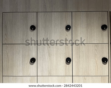 Wall unit with multiple lockable compartments