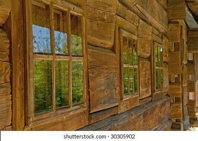 Wall and windows of old, wooden house is in the country