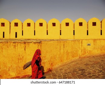 The wall and woman in India - Powered by Shutterstock