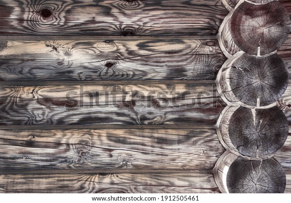 The wall of a wooden house made of timber, processed in a vintage style. Wall mural.