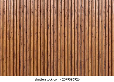 Wall of wooden slats. Wooden floor. Wooden fence. Wooden wall. Modern architectural wall. - Powered by Shutterstock