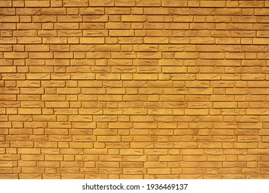 The wall of yellow red bricks
