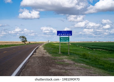 Wallace County, Kansas - May 18, 2021: Welcome To Kansas Sign On A Partly Cloudy Spring Day