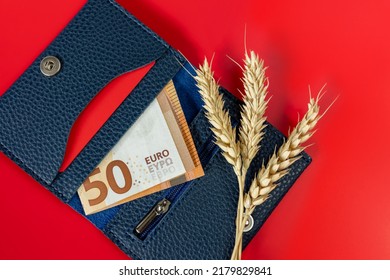 Wallet with 50 euro banknote, credit card and wheat ears. The concept of crisis, shortage of grain crops